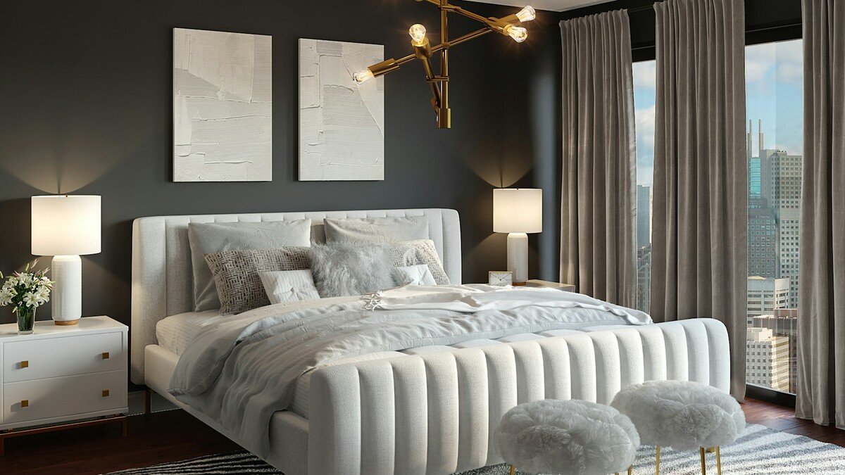 Quarto moderno com cama estofada branca e decoração neutra